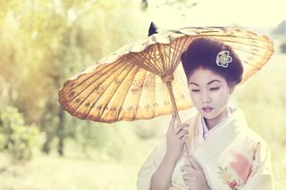 A female model holding an umbrella