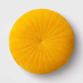 a yellow velvet throw pillow