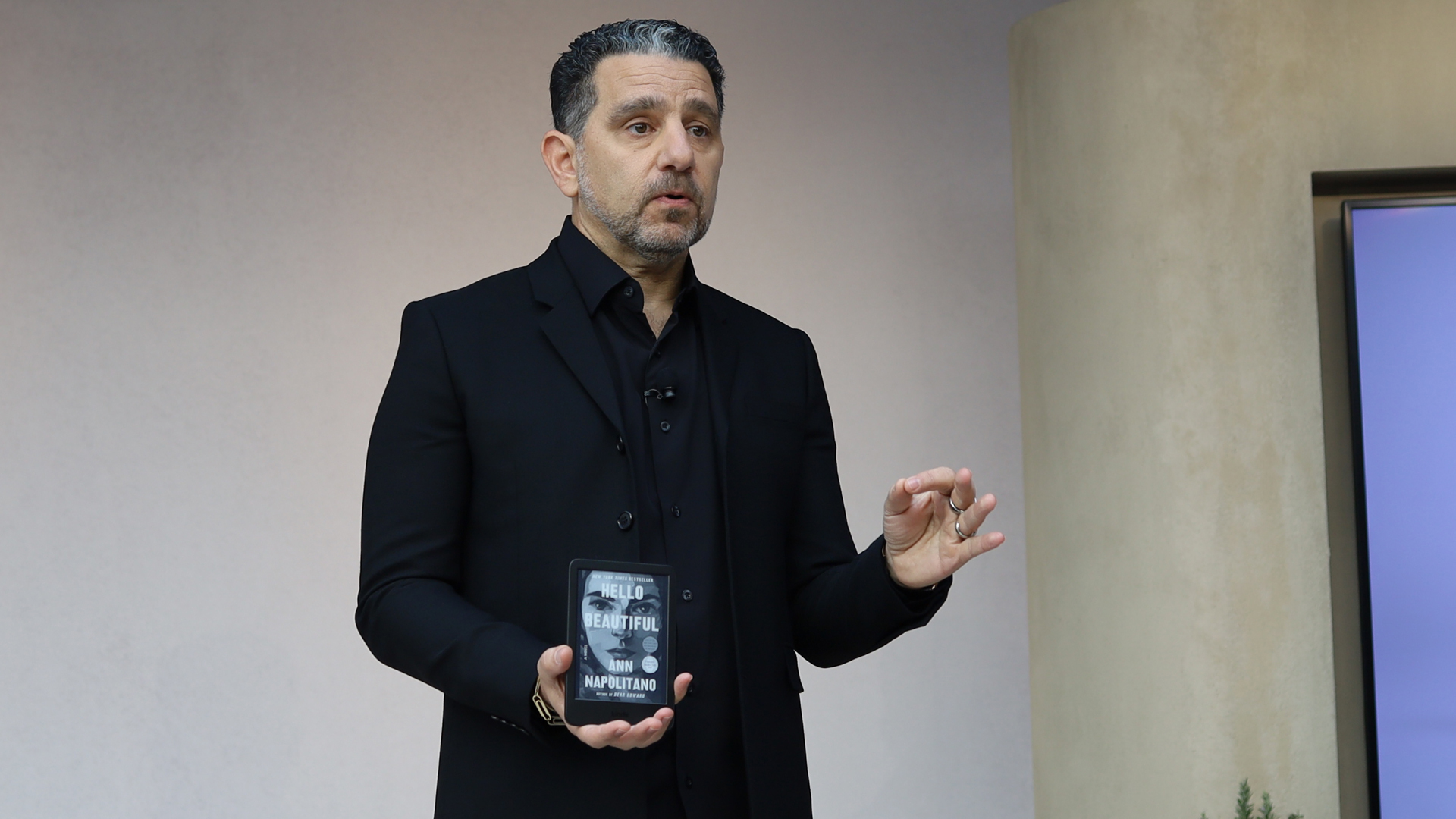 Panos Panay, head of Amazon Devices, holding the new Kindle Paperwhite Signature Edition.