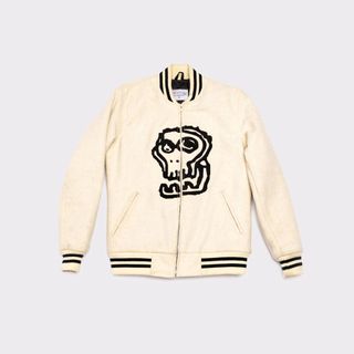 white baseball jacket with black details and graphic