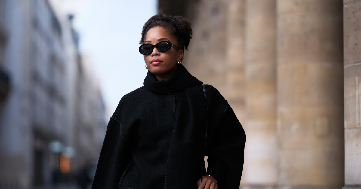Hyperpigmentation in darker skin tones Ellie Delphine wears Celine sunglasses, a black oversized wool scarf, a black coat from Toteme, a heart shaped bag from Alaia, during a street style fashion photo session, on November 06, 2023 in Paris, France