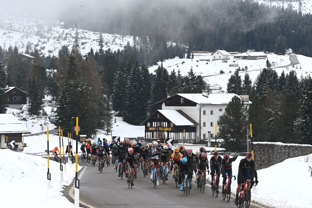 BRUNICO ITALY APRIL 21 A general view of the peloton climbing to the snowy and mountainous pass of the Passo Lavaz 1808m during the 46th Tour of the Alps 2023 Stage 5 a 1445km stage from Cavalese to Brunico on April 21 2023 in Brunico Italy Photo by Tim de WaeleGetty Images