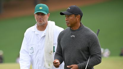 Lance Bennett and Tiger Woods during a practice round before the 2024 edition of The Masters