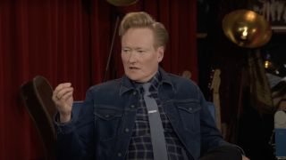 Conan O'Brien seated and speaking for one of the final episodes of his TBS talk show