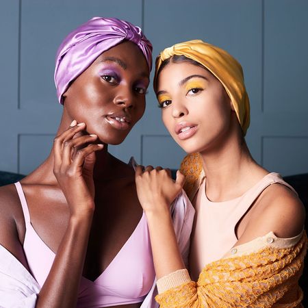 two women wearing silk hair wraps