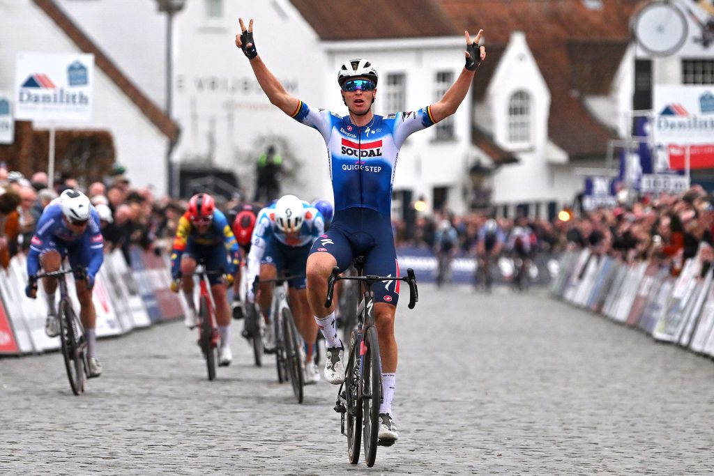 NOKERE BELGIUM MARCH 13 Tim Merlier of Belgium and Team Soudal QuickStep celebrates at finish line as race winner during the 78th Danilith Nokere Koerse 2024 Mens Elite a 1881km one day race from Deinze to Nokere UCIWT on March 13 2024 in Nokere Belgium Photo by Luc ClaessenGetty Images