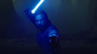 Ewan McGregor poses in Obi-Wan Kenobi's classic fight stance 