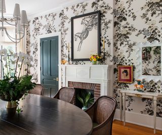 Flower wallpaper, white fireplace, wooden dining table