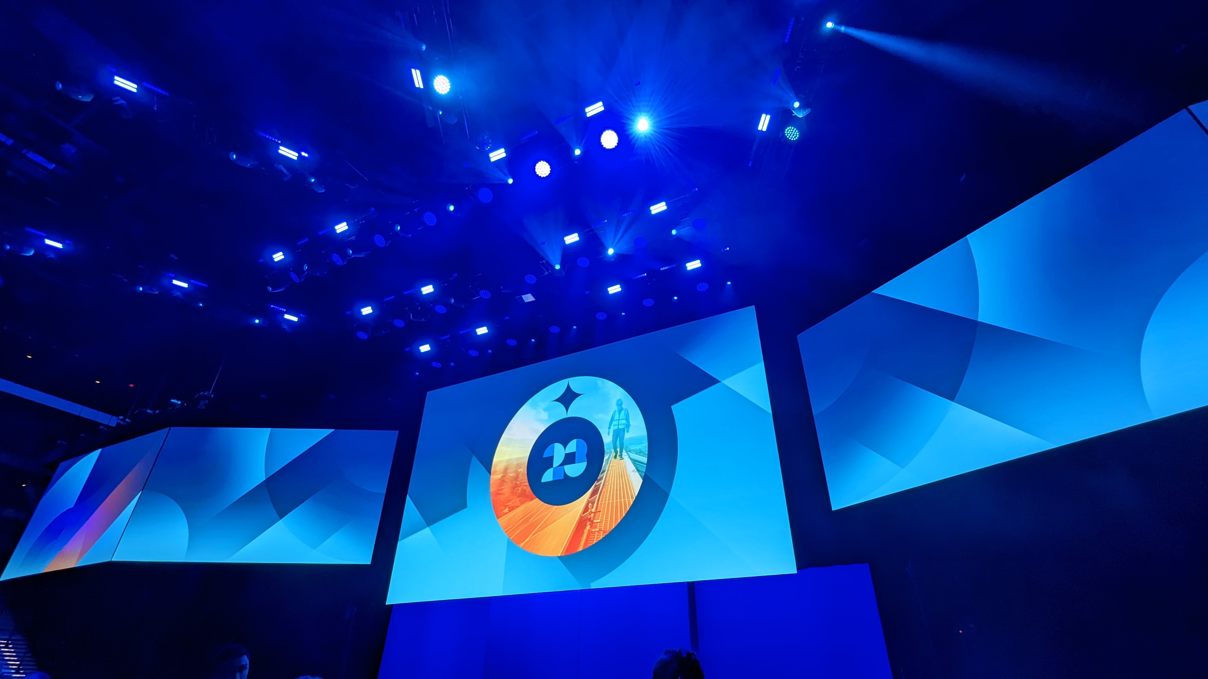 A wide angle shot of the stage at Dell Technologies World, with a stylised circular symbol and the number '23' in the middle