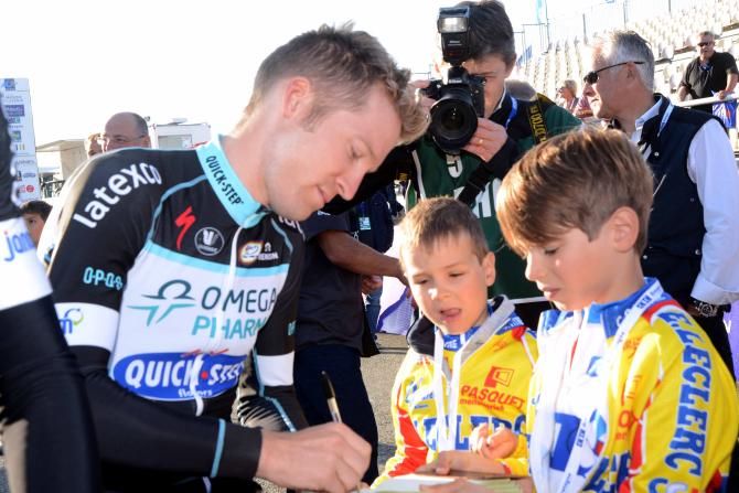 Jan Bakelants (Omega Pharma-Quick Step) signs autographs for some young fans
