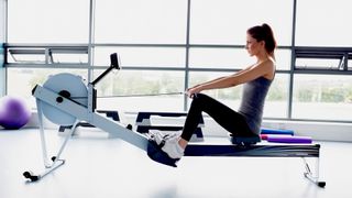 Woman using rowing machine