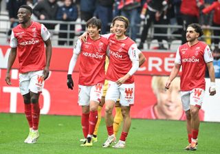 Stade de Reims players celebrate a goal against Metz in March 2024.