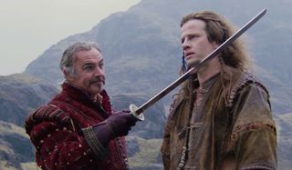 Highlander Sean Connery holds Christopher Lambert by blade
