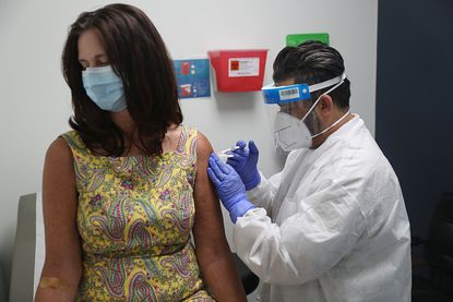 A woman participates in a vaccine trial in Florida.