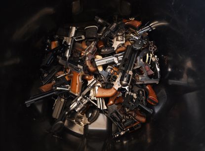 Handguns in a pile