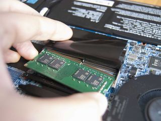 Slide the new RAM into the slot