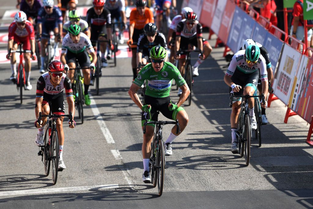 SANTA CRUZ DE BEZANA SPAIN AUGUST 31 Fabio Jakobsen of Netherlands and Team Deceuninck QuickStep Green Points Jersey celebrates at finish line as stage winner ahead of Matteo Trentin of Italy and UAE Team Emirates L during the 76th Tour of Spain 2021 Stage 16 a 180km stage from Laredo to Santa Cruz de Bezana lavuelta LaVuelta21 on August 31 2021 in Santa Cruz de Bezana Spain Photo by Tim de WaeleGetty Images