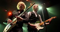 Rick Parfitt [left] and Francis Rossi give their Telecasters a good thrashing during a 2010 live performance in Perth, Australia.