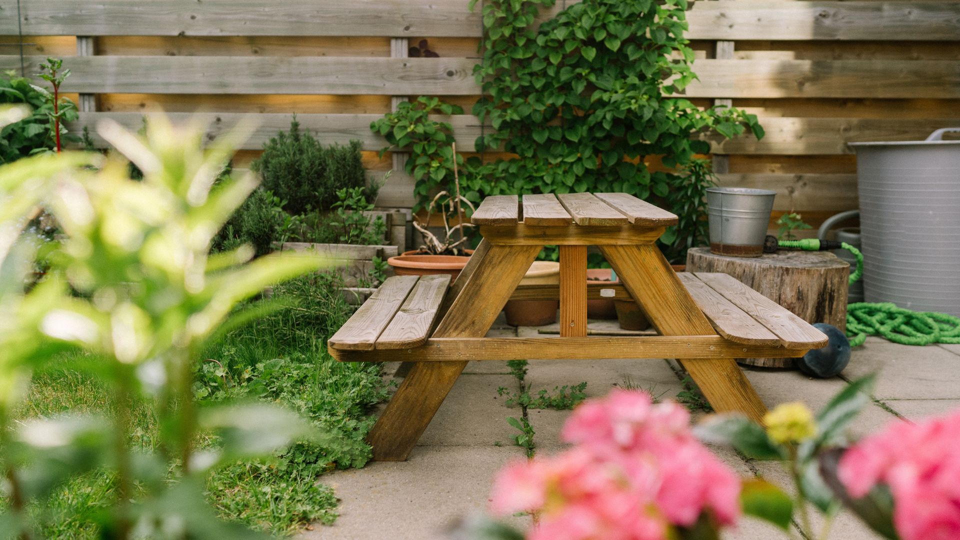 picture of wooden picnic table in garden