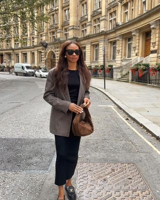 What to wear in October: @symphonyofsilk wears a blazer and midi dress with loafers