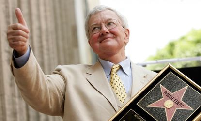 Roger Ebert gives a thumbs-up after receiving a star on the Hollywood Walk of Fame in Hollywood in 2005.