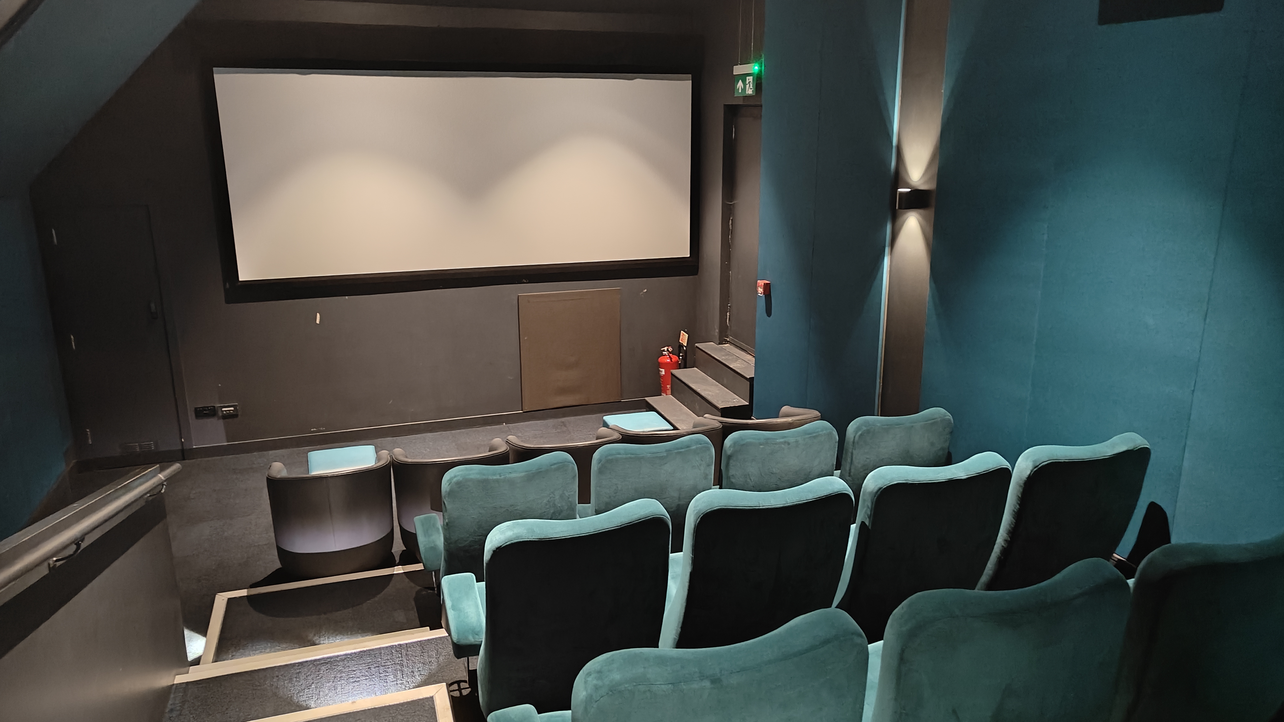 cinema screen with blue seats