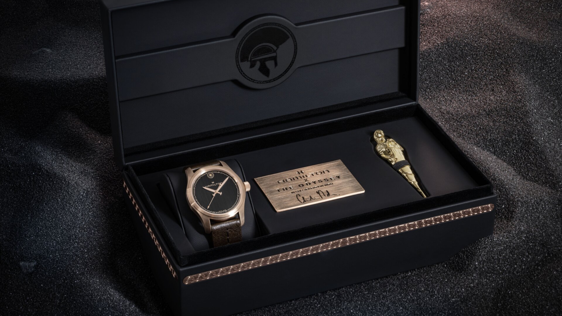 Hamilton limited edition watch for The Odyssey in a box whilst against black sand 