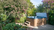A hot tub in a garden