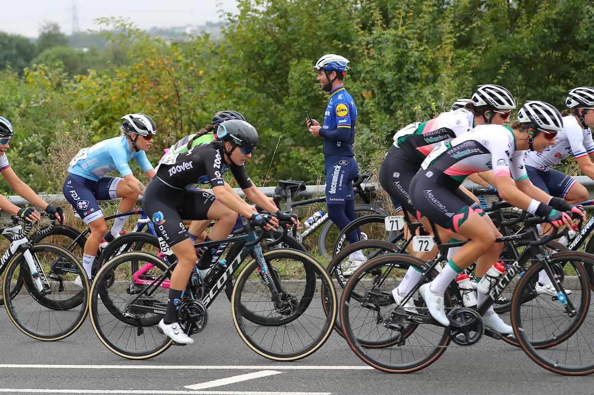 Picture by Alex Whitehead/SWpix.com - 07/10/2021 - Cycling - AJ Bell Women's Tour of Britain - Stage Four: Shoeburyness to Clacton-on-Sea, England - Juliette Labous of Team DSM in action with Mark Cavendish spectating