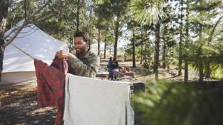 how to wash clothes while camping: hanging clothes out at camp