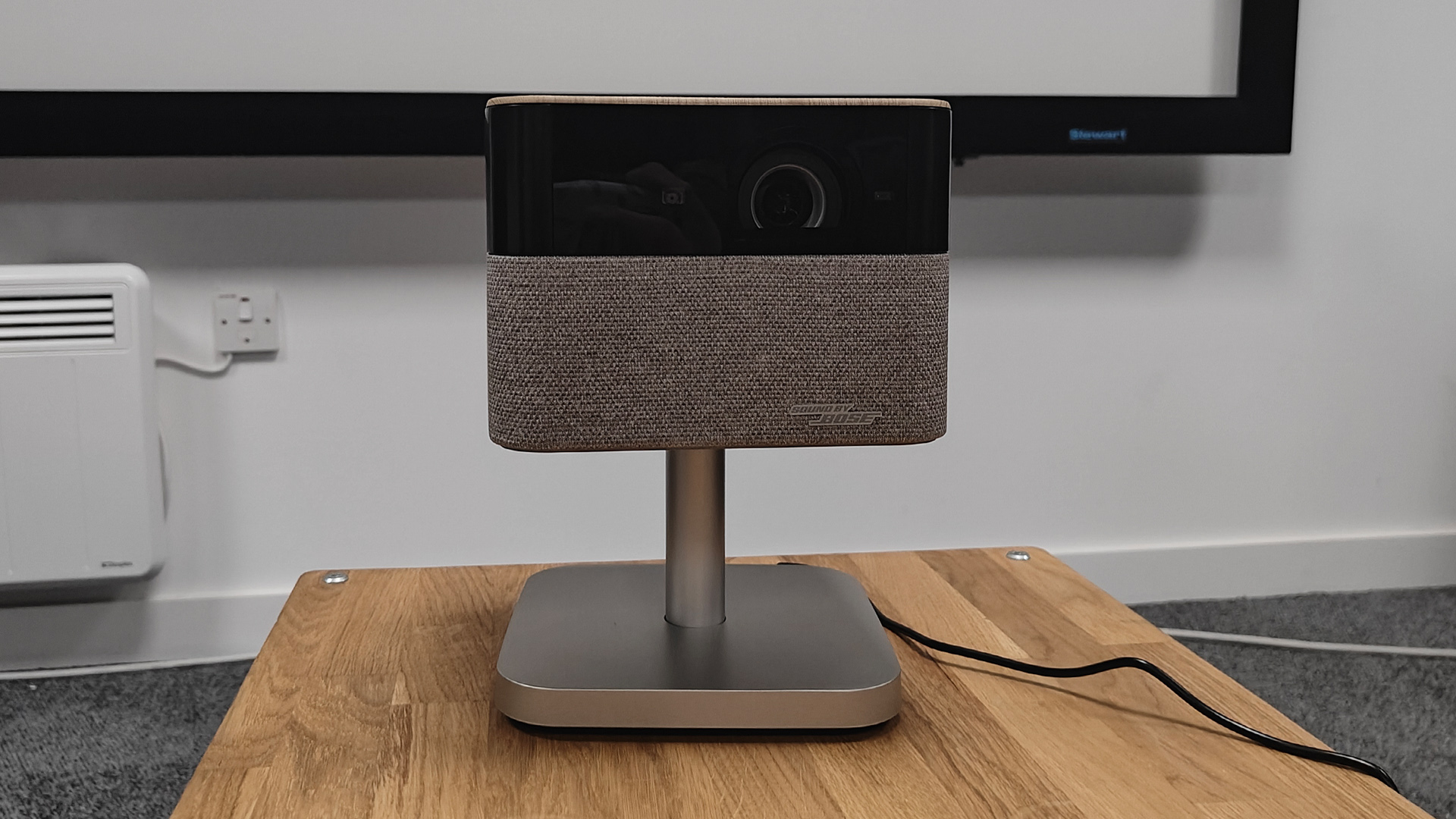 Epson EF-72 home cinema projector on wooden coffee table, screen just visible