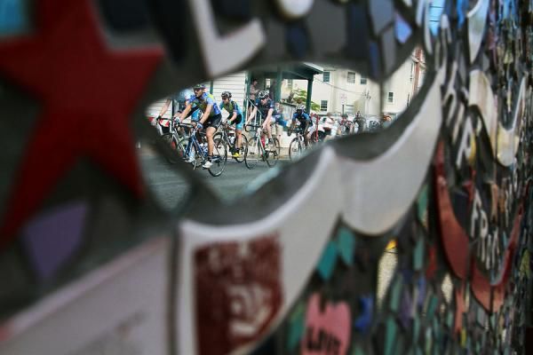 As the riders progress through downtown, they&rsquo;re reflected in the 9/11 memorial.