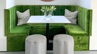 Green velvet banquette and scalloped-edged stools