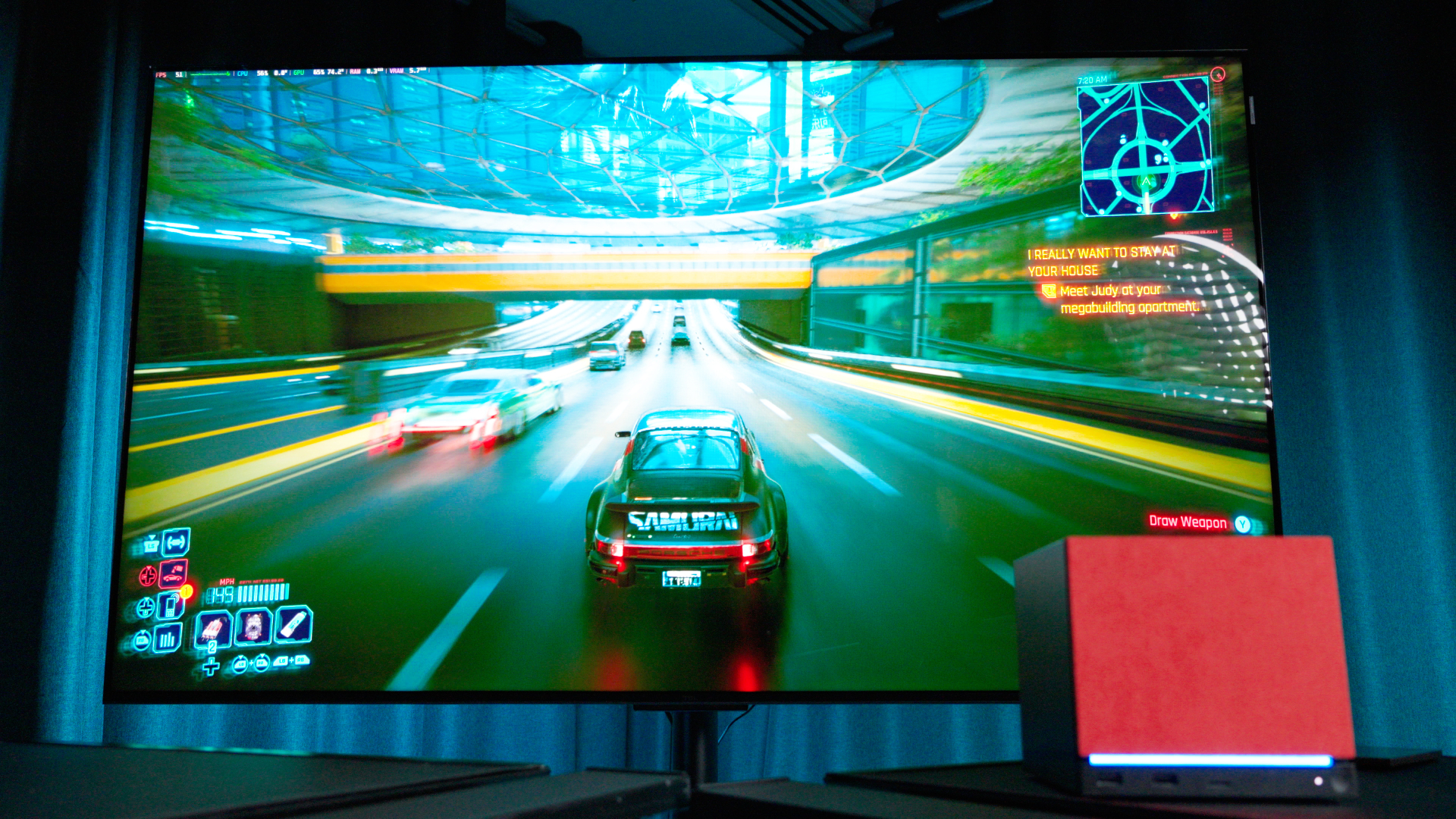 A Steam Machine running Cyberpunk 2077 at 4K resolution on a 55-inch TV
