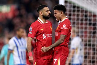 LIVERPOOL, ENGLAND - NOVEMBER 02: Mohamed Salah of Liverpool celebrates scoring his team's second goal with teammate Luis Diaz during the Premier League match between Liverpool FC and Brighton & Hove Albion FC at Anfield on November 02, 2024 in Liverpool, England. (Photo by Jan Kruger/Getty Images)