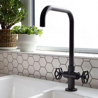 bathroom with black tap and wash basin
