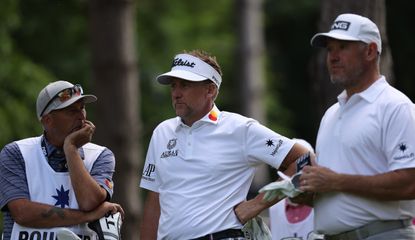 Ian Poulter and Lee Westwood wait on the tee