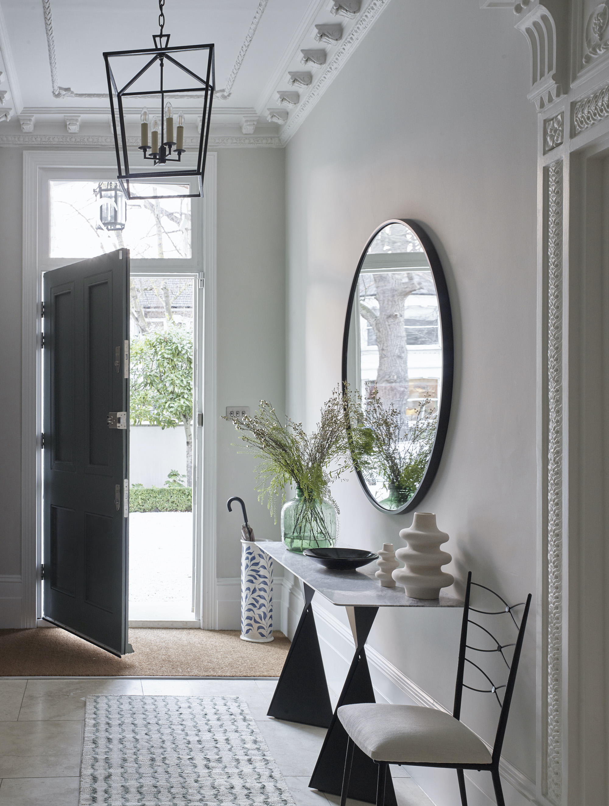 Luxurious white hallway with sculptural console table
