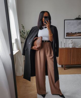 @femmeblk wearing brown tailored trousers and top