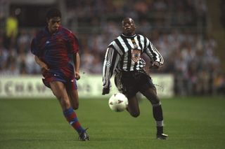 Michael Reiziger (left) of Barcelona takes on Faustino Asprilla (right) of Newcastle United during the Champions League match in 1997