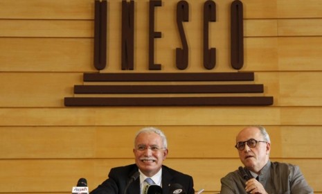 Palestinian Foreign Minister Riyad al-Malki and Palestinian ambassador to UNESCO Elias Sanbar during Monday's announcement of Palestine's membership into the U.N.'s cultural agency.