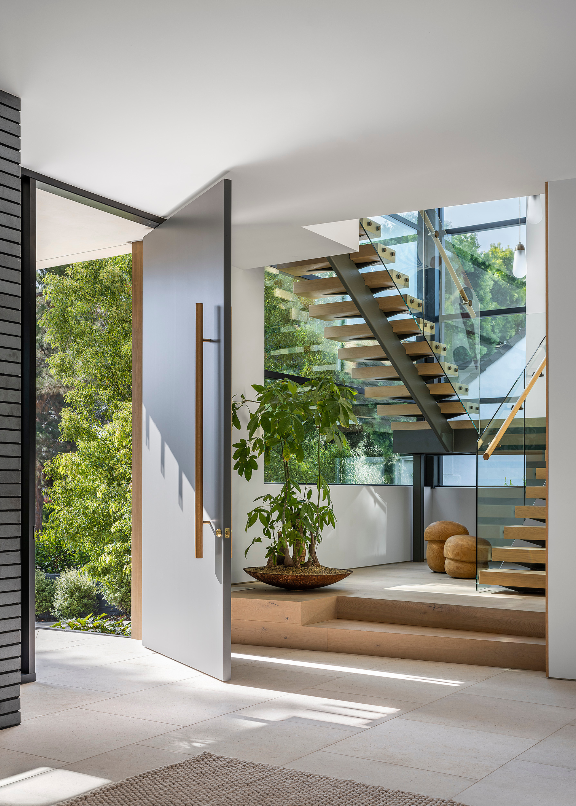An entryway by a staircase leading to the upper floor