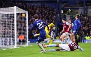 Aaron Wan-Bissaka of West Ham United (obscured) scores an own goal for Chelsea's second goal, as Cole Palmer of Chelsea looks on during the Premier League match between Chelsea FC and West Ham United FC at Stamford Bridge on February 03, 2025 in London, England.