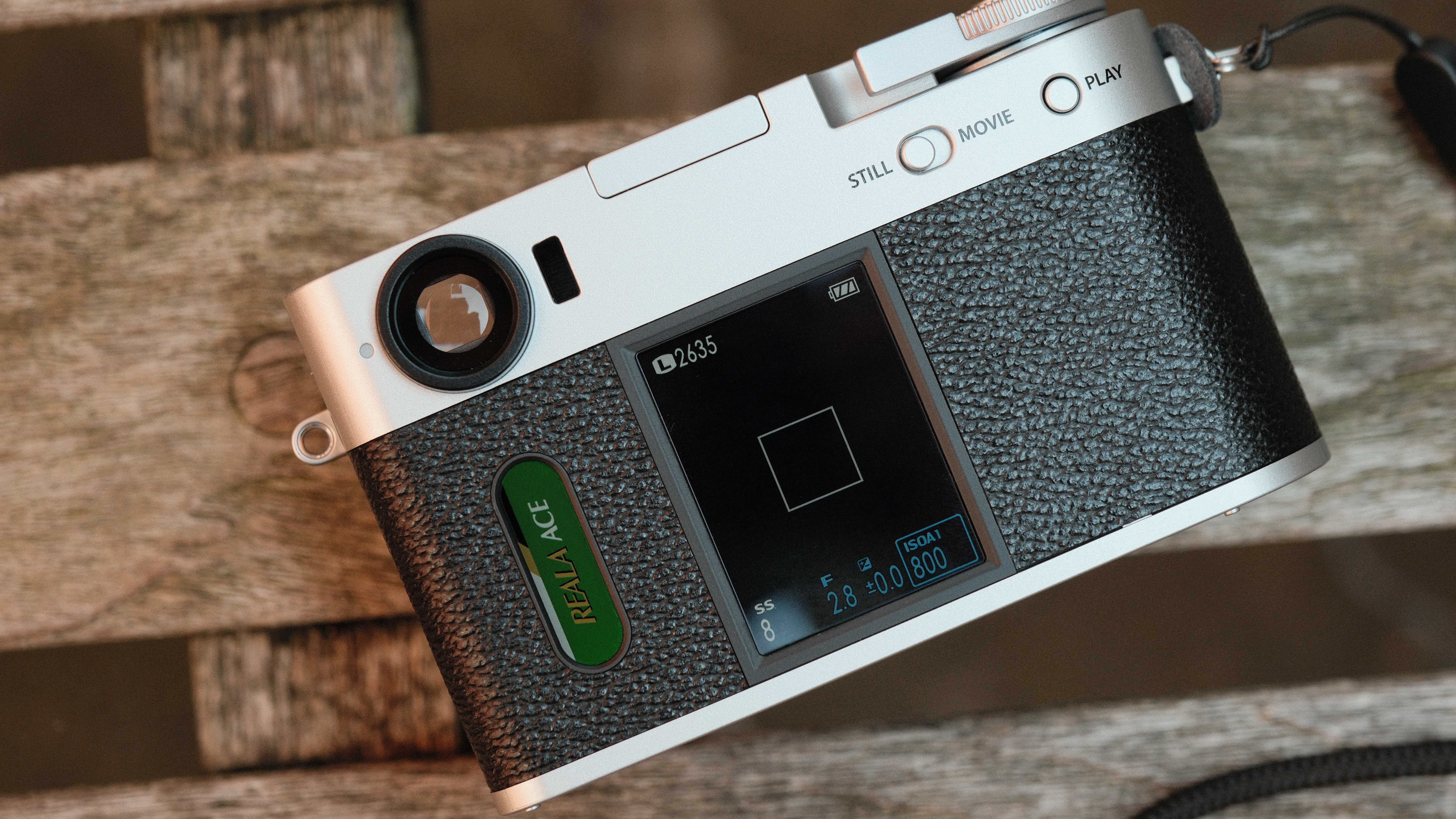 Fujifilm X Half camera on a wooden bench