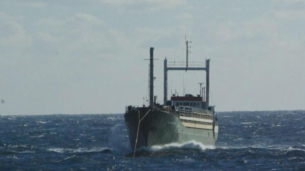 Ship abandoned by crew and filled with migrants towed to Italy