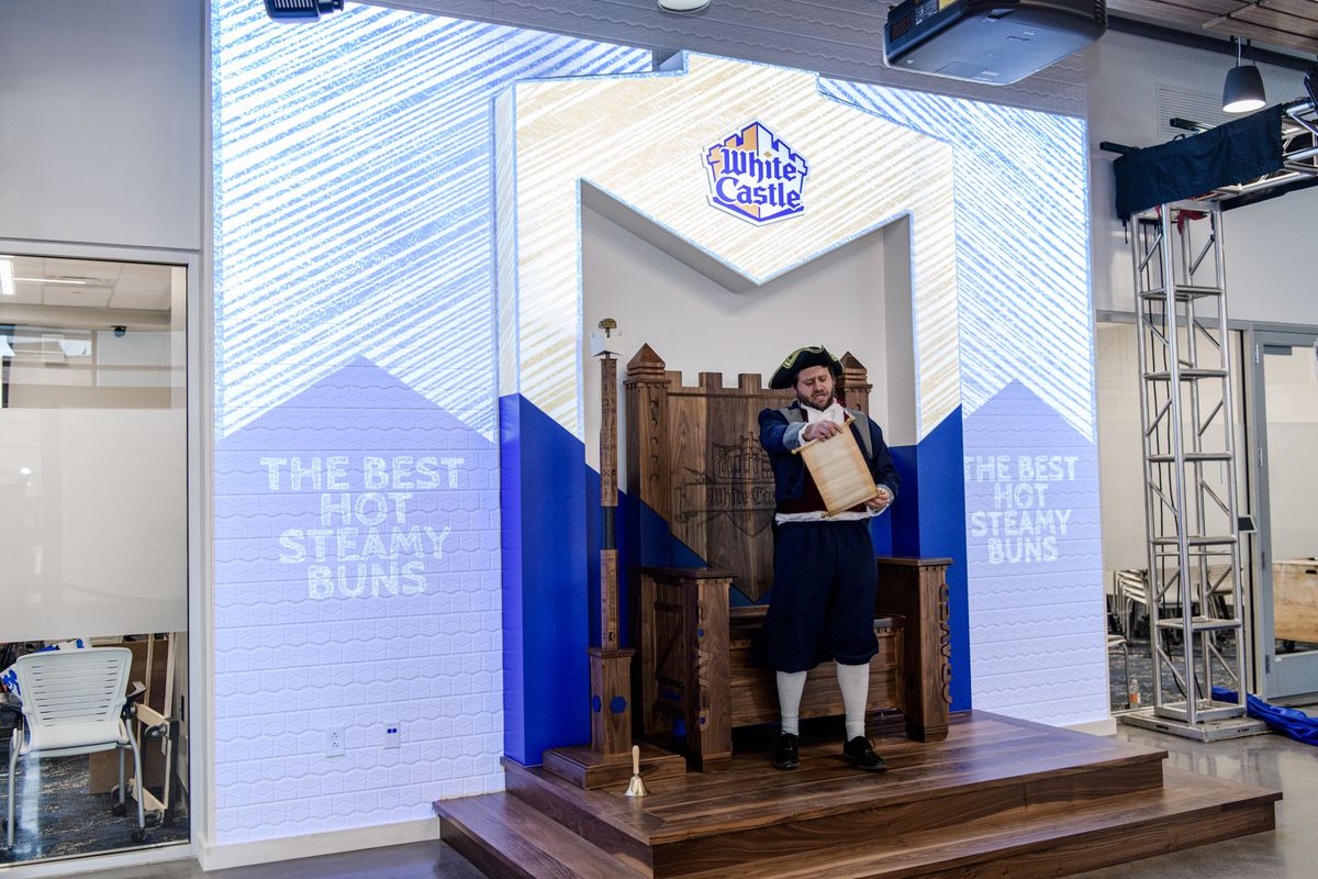 White Castle&#039;s Town Crier character stopped by the recent unveiling party, introducing the company’s Craver Throne with an official proclamation and a speech.