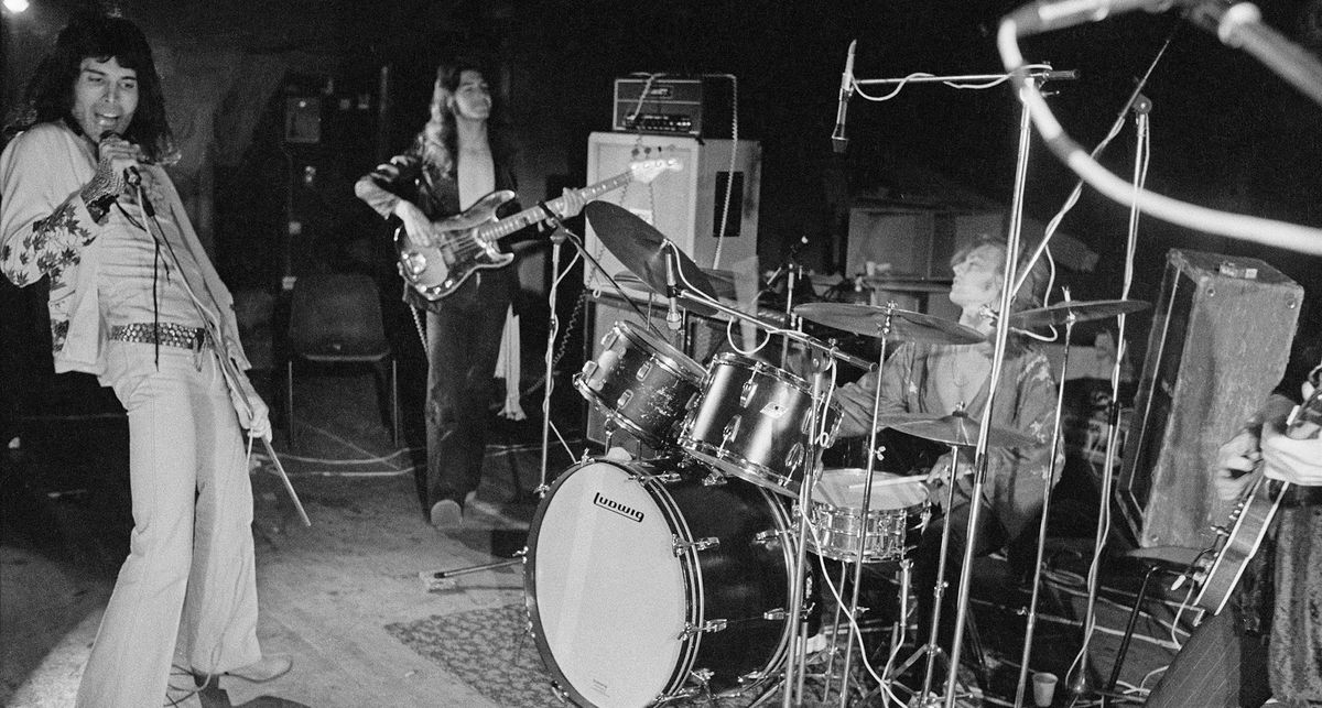 Queen rehearse in 1973. This black-and-white image captures Freddie Mercury on the far left, John Deacon on his Fender Precision bass, and Roger taylor on the right behind his Ludwig drumkit.