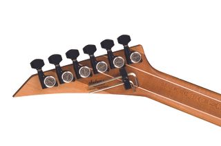 The headstock of a Jackson American Series Virtuoso guitar