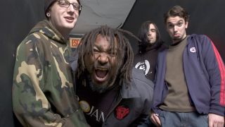 Skindred backstage at a show in 2004, shouting at the camera