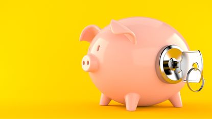 A piggy bank has a lock and key in its side.